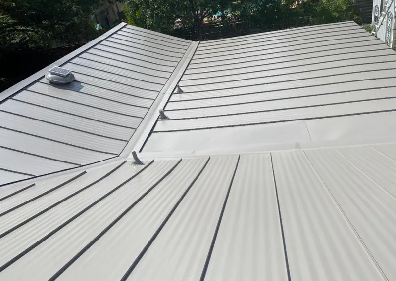 Solar attic fan installed on a metal roof for Roof Ventilation in Fort Thomas